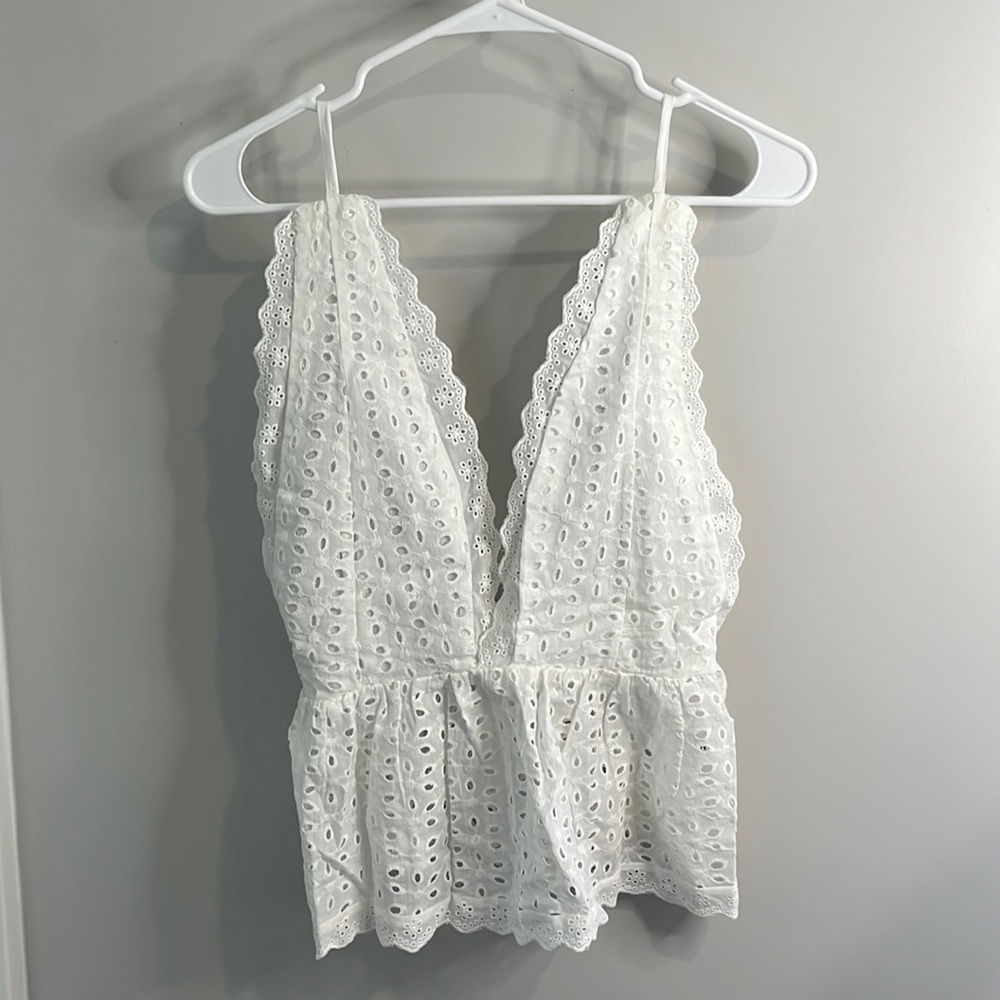 White sleeveless top